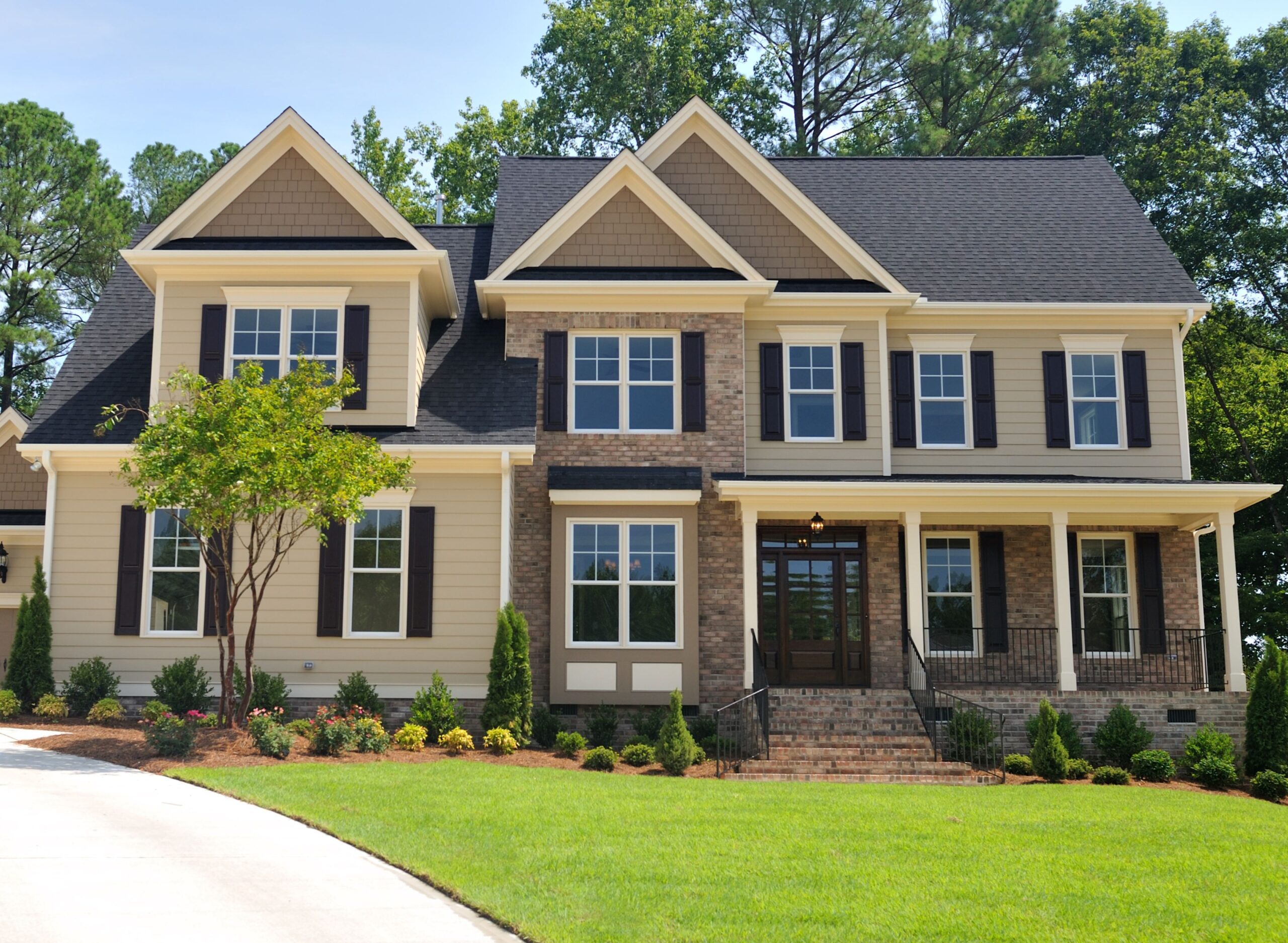 font view of brick house and green lawn