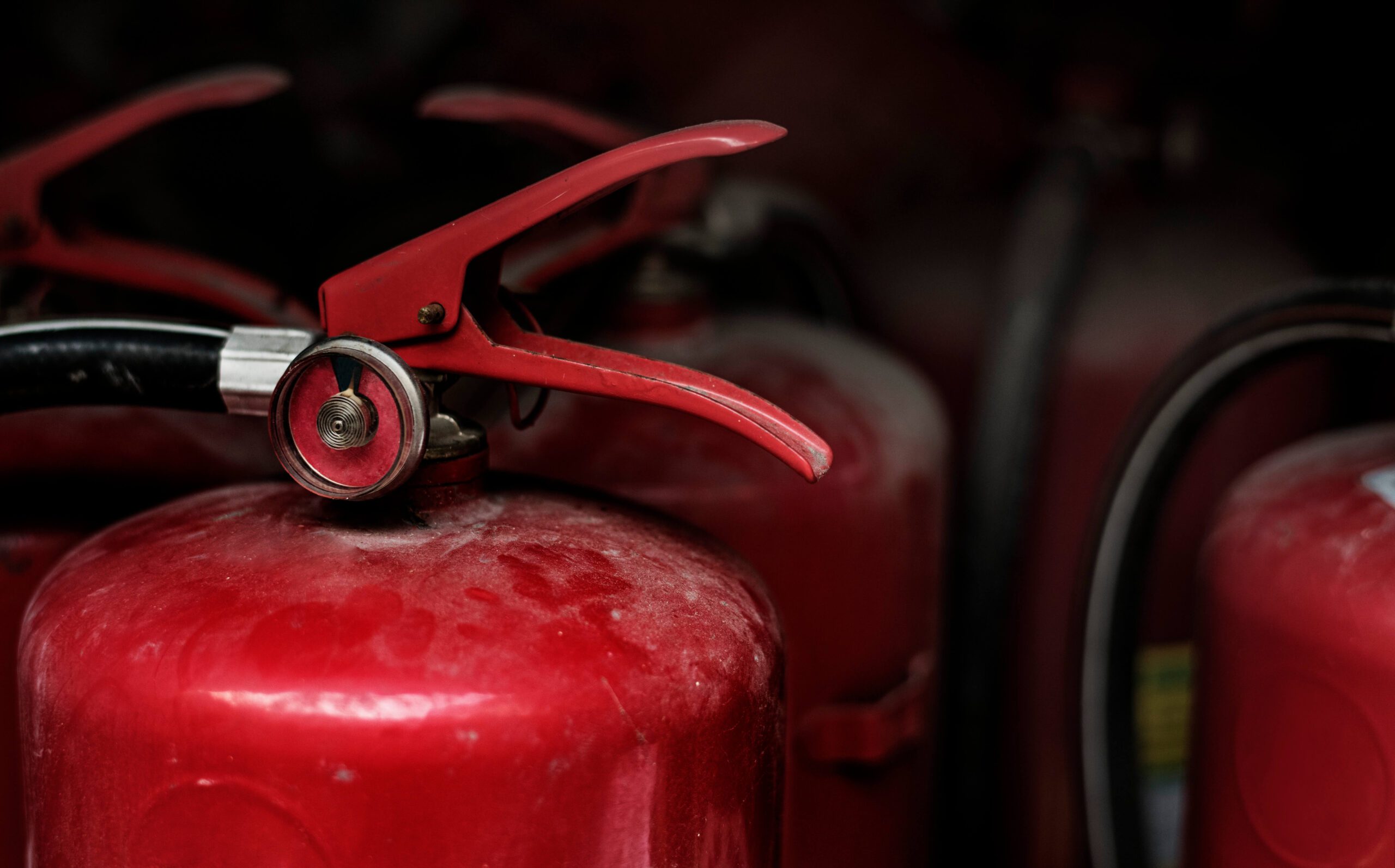 closeup-of-red-fire-extinguishers